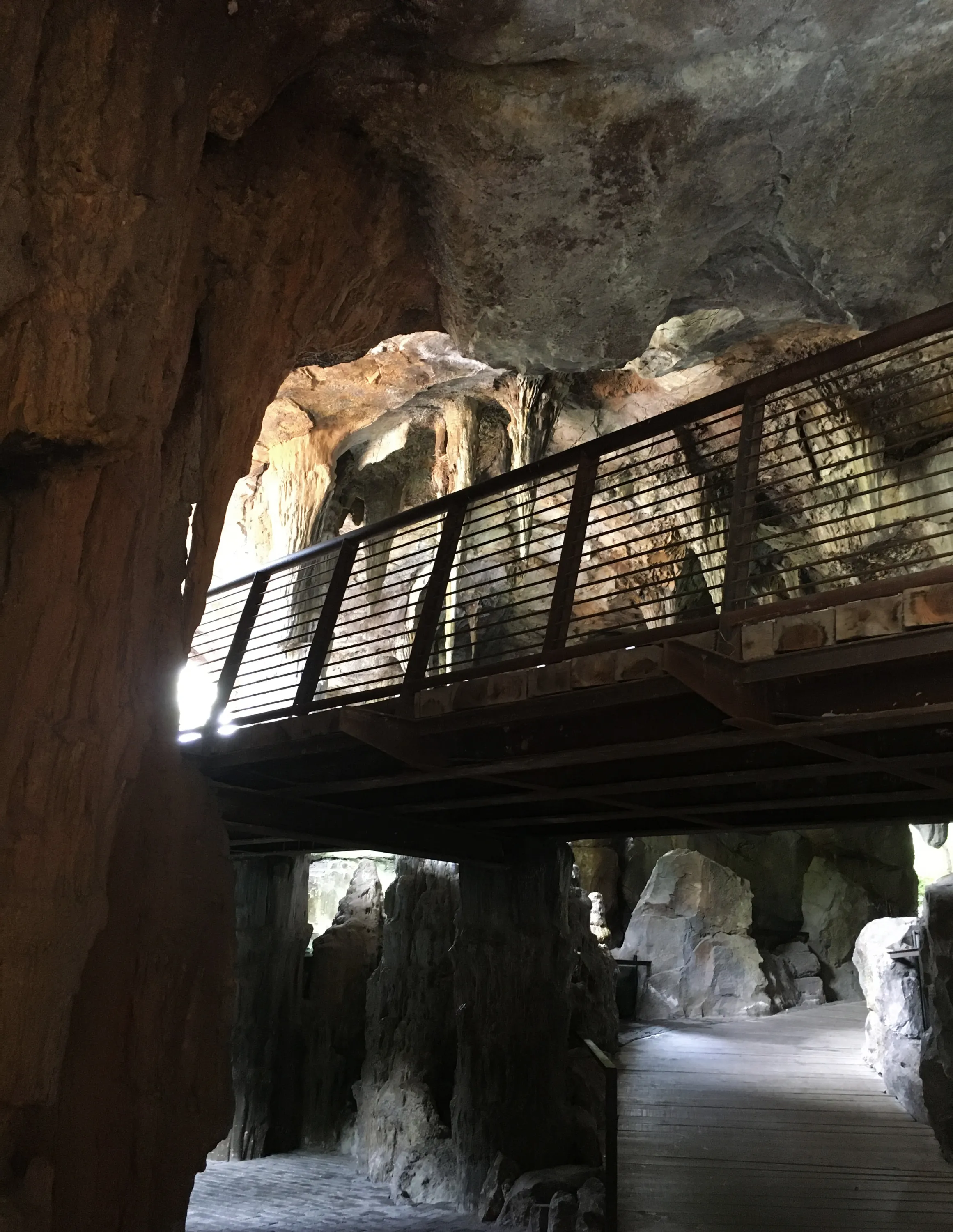 A suspended pathway running through a cave.