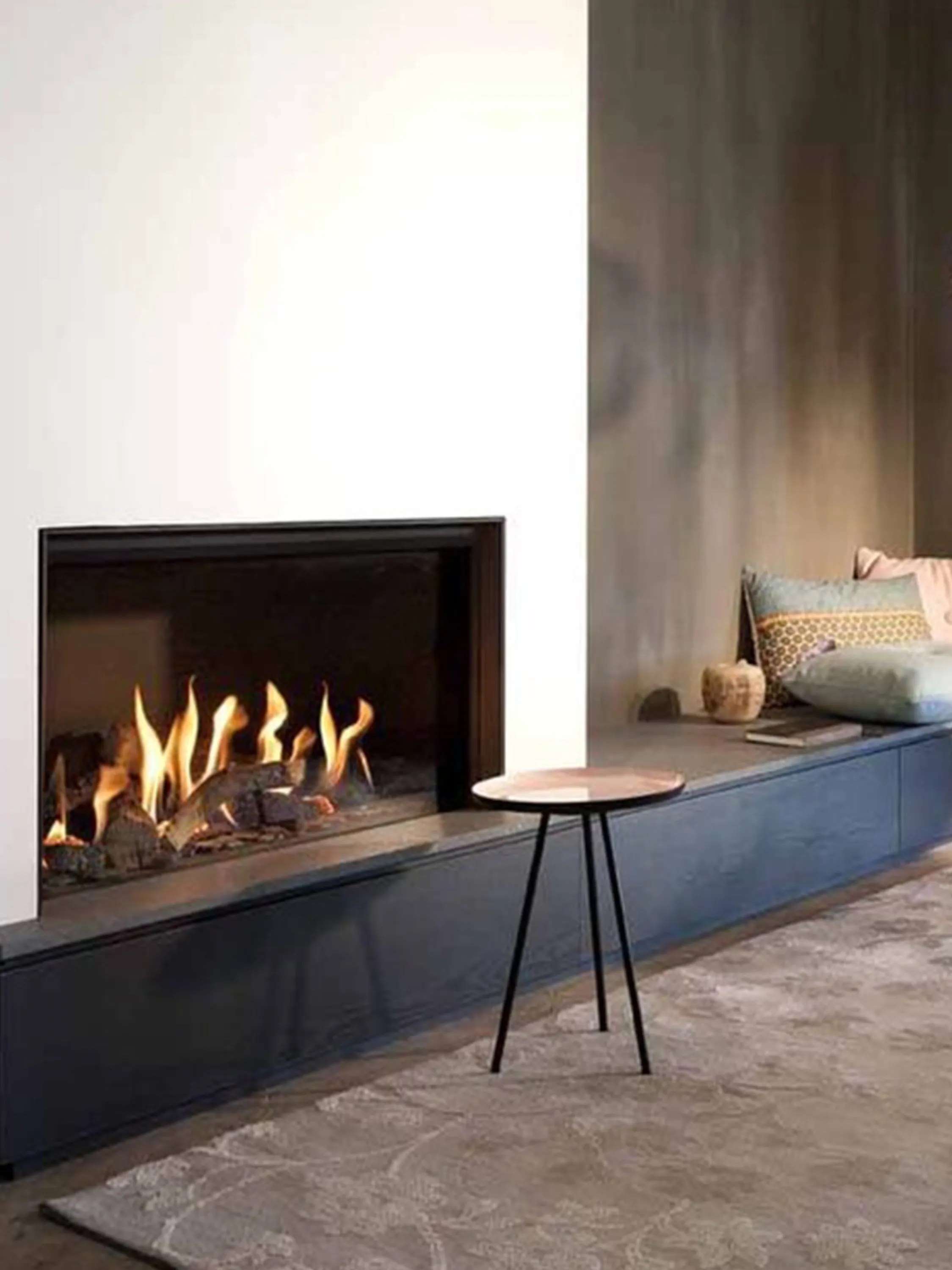 Contemporary living room with a crackling fireplace.