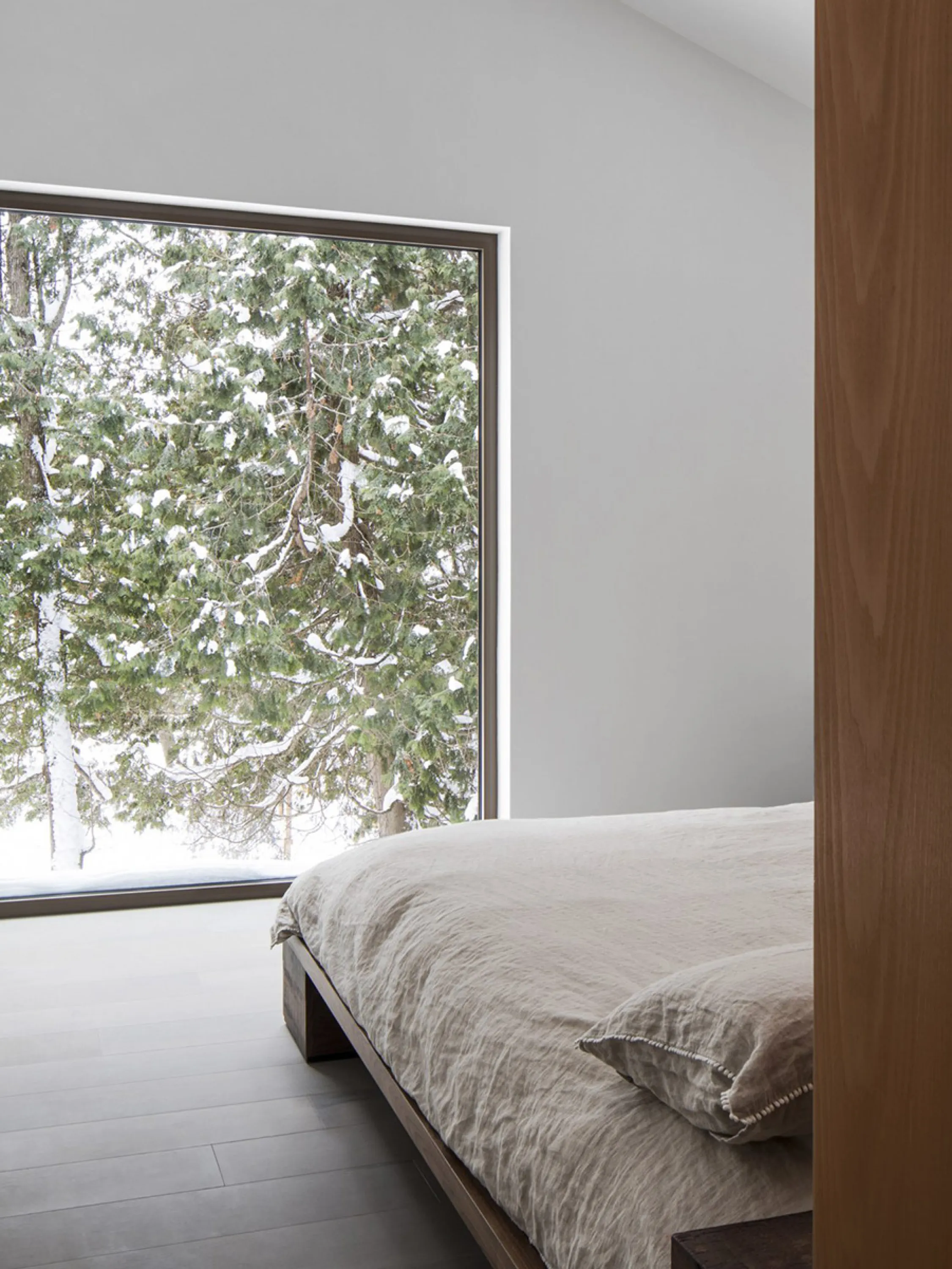 Bedroom with winter outside view.